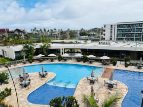 Mana Beach Experience - flat com 2 quartos sendo uma suíte 2 vagas de garagem -Muro Alto a 300 metros da praia -Com vista para a piscina e mar